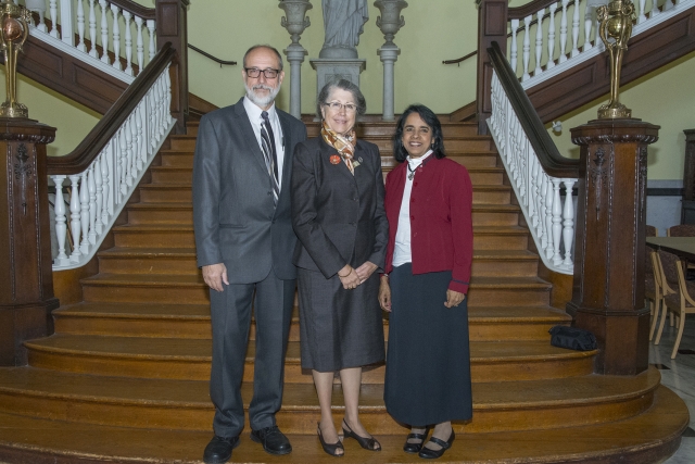 Martin Keszler, M.D., and Mary Lenore Gricoski Keszler, M.D., '74 stand with Lakshmi Atchison, Ph.D., professor of biology and the coordinator of the series, prior to the lecture.  