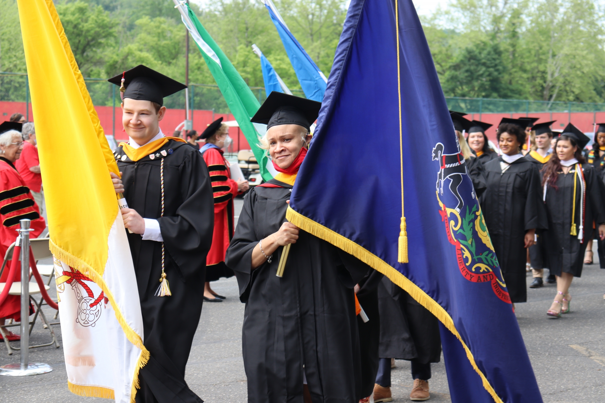 Students carrying the Papal flag and State flag of Pennsylvania helped lead the procession for the Commencement Ceremony for the Class of 2020 and 2021.