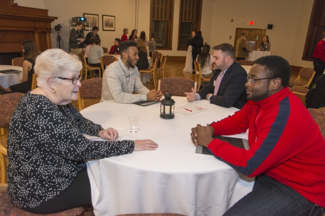 Alumni and students interact during networking night in February.