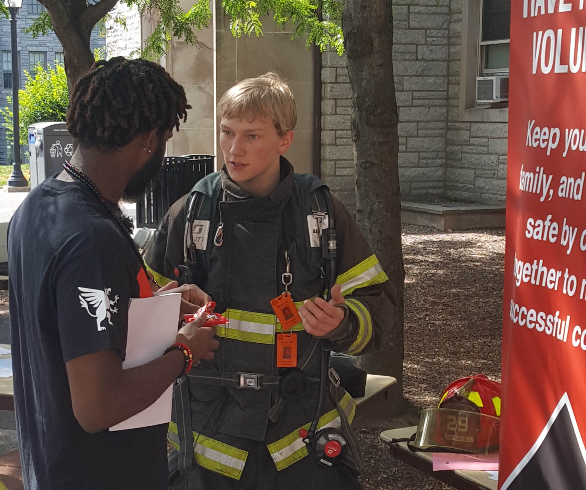 Derek Smith explains the goals of CHC's Firefighting club to a fellow student.